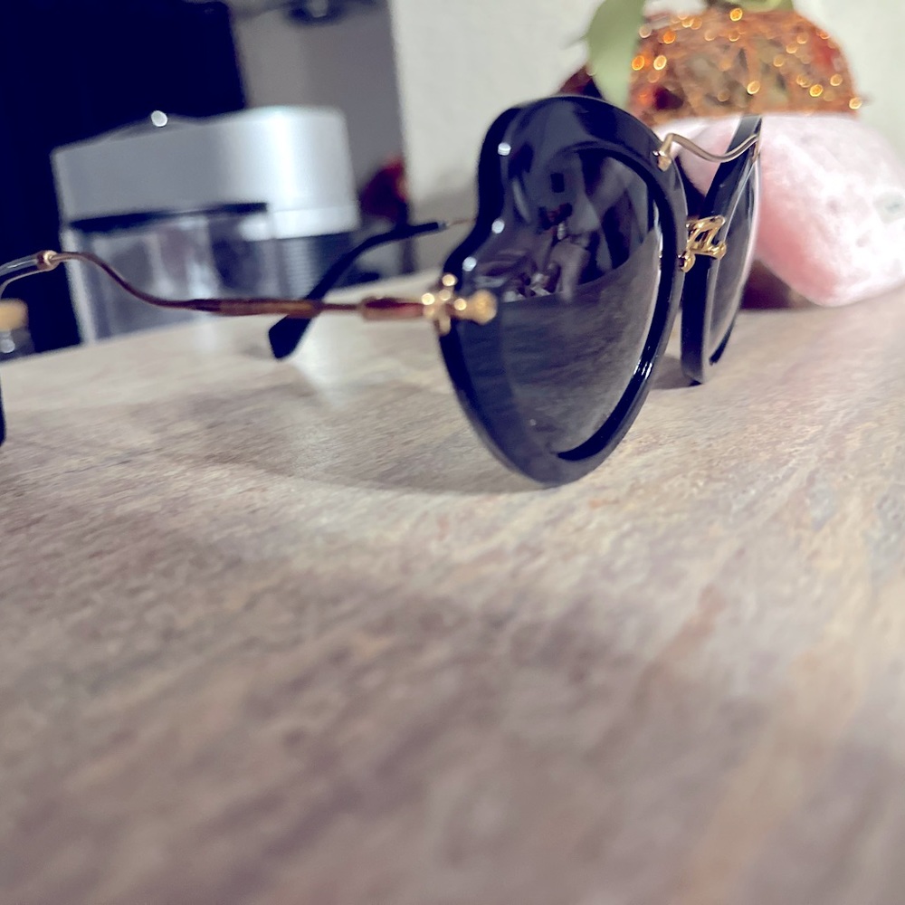 Sunglasses miu miu